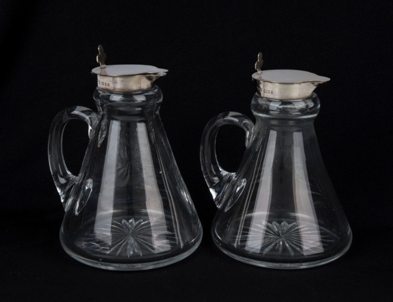 A pair of antique whisky dram jugs with sterling silver tops, 12cm high overall