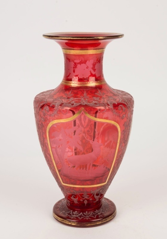 An antique Bohemian ruby glass vase with wheel cut animal scene vignettes, 19th century, ​​​​​​​25cm high