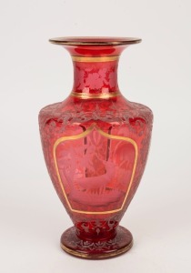 An antique Bohemian ruby glass vase with wheel cut animal scene vignettes, 19th century, 25cm high