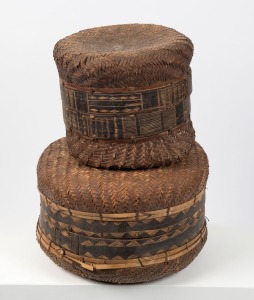 Two tribal baskets, woven cane and wood, South African origin. PROVENANCE: The Brosset Collection. The larger 30cm high x 43cm wide