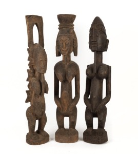 Three tribal statues, carved wood, West African origin,  ​​​​​​​the largest 71cm high