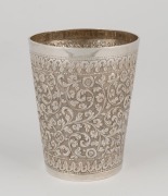 An antique Indian silver beaker, 19th century, base crudely engraved with later presentation inscription, 9.5cm high, 151 grams - 2