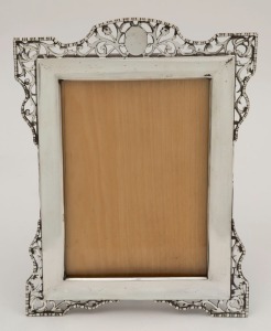 A sterling silver table picture frame, made in Birmingham, circa 1913, 20cm high