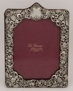 An English pierced sterling silver picture frame by H. Matthews of Birmingham, circa 1902, ​​​​​​​28cm high