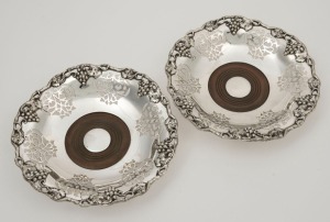 A pair of antique Sheffield plate bottle coasters with grape motif, 19th century, 20.5cm wide