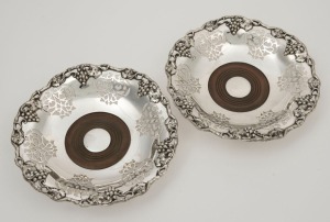 A pair of antique Sheffield plate bottle coasters with grape motif, 19th century, ​​​​​​​20.5cm wide