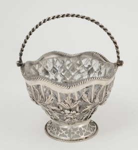 A Georgian sterling silver and cut crystal bon bon dish with swing handle, made in London, circa 1771, 14.5cm high