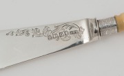 An antique English condiment set, comprising a stilton scoop, pickle fork and pate knife, sterling silver and ivory, made in Sheffield, circa 1882, (3 items), the scoop 22cm long - 3