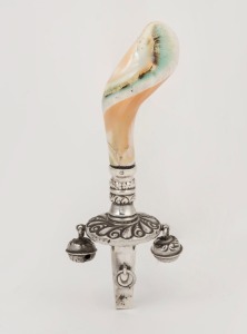 An antique sterling silver and shell baby's rattle by G.E. Walton & Co. of Birmingham, circa 1900, 11cm long