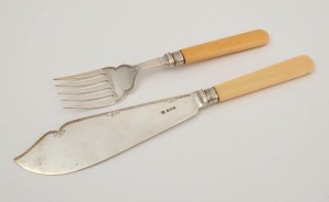 A pair of sterling silver fish servers with ivory handles by Barker Brothers Ltd. of Birmingham, early 20th century, the knife 28cm long