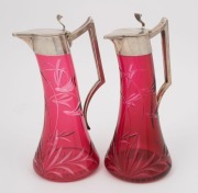 A pair of antique German silver and cut ruby glass schnapps decanters, 19th century, stamped "800" with crown and crescent mark, ​​​​​​​20cm high - 2