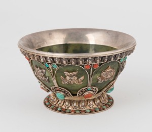 A Tibetan silver mounted jade bowl encrusted with coral and turquoise, 19th/20th century, 6cm high, 10cm diameter