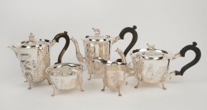 A five piece Irish silver tea set decorated with engraved rural scenes adorned with animal finials, made in Dublin, 20th century, the tea pot 19cm high, 2,646 grams total including handles