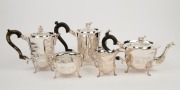 A five piece Irish silver tea set decorated with engraved rural scenes adorned with animal finials, made in Dublin, 20th century, the tea pot 19cm high, 2,646 grams total including handles - 2