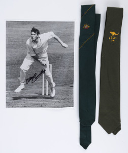 1968 AUSTRALIAN TOUR OF ENGLAND: Alan Connolly's official Australian team silk tie with embroidered Australian coat-of-arms; another Australian team tie in pure green wool, with embroidered kangaroo over "LXVIII / U.K."; together with an autographed photograph of Connolly bowling during that tour. With 23 wickets, Connolly was the most successful bowler from both teams in the Series.
