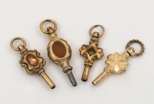 Four antique pocket watch keys, 14ct and 15ct yellow gold examples, 19th century, the largest 3.5cm long