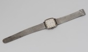 LONGINES manual wristwatch in square stainless steel case with silver dial, baton numerals and stainless steel mesh band, circa 1960. 3.1cm wide including crown - 2