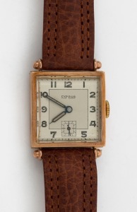 CYPRUS manual wristwatch in square solid 9ct gold case, silver dial, subsidiary second hand, Arabic numerals and brown leather band, circa 1960. 2.7cm wide including crown