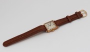 CYPRUS manual wristwatch in square solid 9ct gold case, silver dial, subsidiary second hand, Arabic numerals and brown leather band, circa 1960. 2.7cm wide including crown - 2