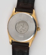 OMEGA "SEAMASTER" wristwatch in rolled gold and stainless steel case with gold dial, date window, baton numerals and brown leather band, circa 1970. 3.8cm wide including crown - 3