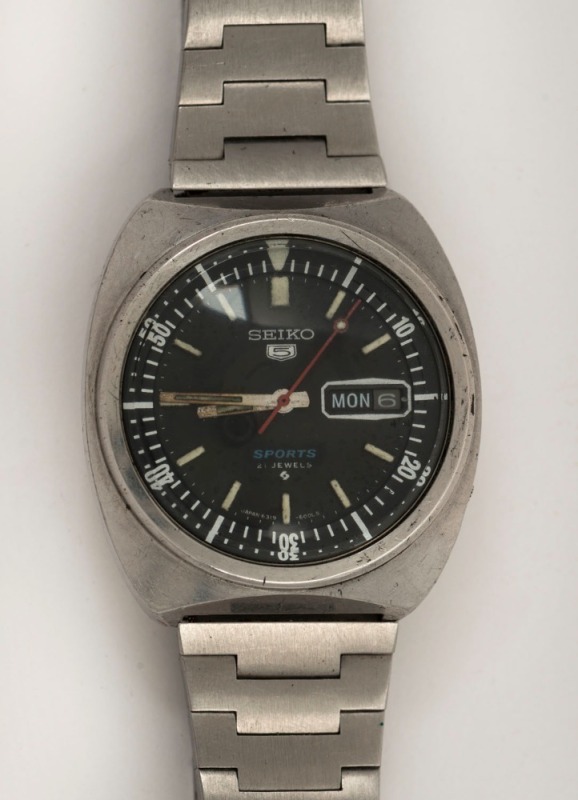 SEIKO "5 SPORTS" automatic wristwatch in stainless steel case with black dial, date window, rotating internal bezel, baton numerals and original Seiko stainless steel band, circa 1970. 3.8cm wide including crown