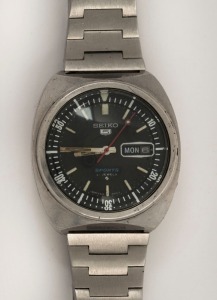 SEIKO "5 SPORTS" automatic wristwatch in stainless steel case with black dial, date window, rotating internal bezel, baton numerals and original Seiko stainless steel band, circa 1970. 3.8cm wide including crown