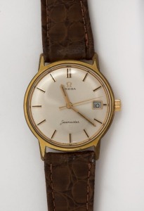 OMEGA "SEAMASTER" automatic wristwatch in rolled gold and stainless steel case with silver dial, date window, baton numerals and brown band, circa 1960. 3.7cm wide including crown