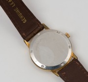 OMEGA "SEAMASTER" automatic wristwatch in rolled gold and stainless steel case with silver dial, date window, baton numerals and brown band, circa 1960. 3.7cm wide including crown - 3