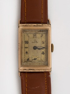 OMEGA manual wristwatch in rectangular rolled gold and stainless steel case with gold dial, subsidiary second hand, circa 1940. 2.2cm wide including crown