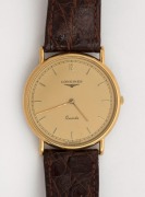 LONGINES wristwatch in rolled gold and stainless steel case with gold dial, circa 2000, with original brown leather band. Housed in original box with papers, 3.5cm wide including crown