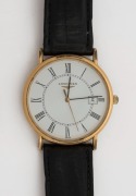 LONGINES wristwatch in rolled gold and stainless steel case with white dial, date window, Roman numerals, circa 1990, original black leather band. Housed in original box, 3.5 cm wide including crown