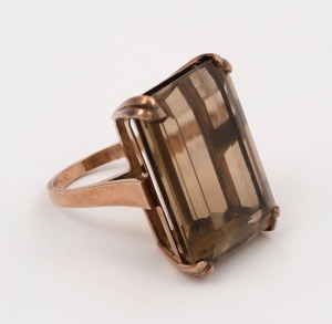 A 9ct rose gold ring, set with a large emerald cut smoky quartz specimen, ​​​​​​​14 grams total
