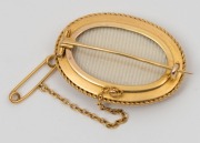 An antique 18ct yellow gold oval brooch, set with three diamonds, circa 1870, reverse fitted with mourning window, and housed in original box, ​​​​​​​4cm wide, 13.6 grams total - 3