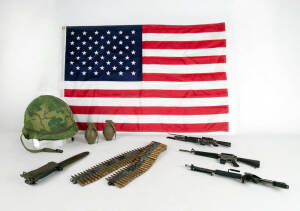 A group lot of American Vietnam war period items, including model M16's, bullet & grenades (disarmed), bayonets, military bags, American flag etc. Inspection will reward.