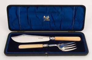 A pair of antique sterling silver and ivory fish servers in original plush fitted box, by George Hape of Sheffield, circa 1904, the box 34cm wide