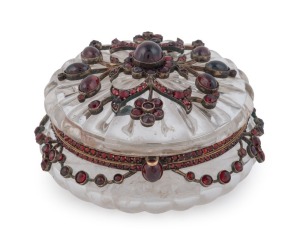 A stunning antique Bohemian jewellery box, carved crystal in gold mount set with garnets, 19th century, 4cm high, 7.5cm diameter