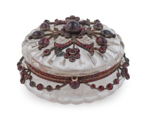 A stunning antique Bohemian jewellery box, carved crystal in gold mount set with garnets, 19th century, 4cm high, 7.5cm diameter