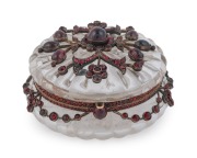 A stunning antique Bohemian jewellery box, carved crystal in gold mount set with garnets, 19th century, 4cm high, 7.5cm diameter