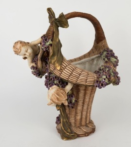 AMPHORA pottery basket vase with applied flowers and cupid figures, circa 1920, oval factory mark to base, 47cm high
