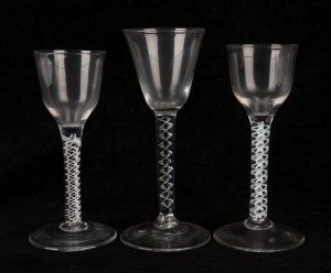 Three Georgian air twist glasses, 18th century, the largest 15.5cm high