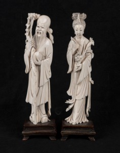 A pair of Chinese carved ivory statues on wooden bases, early to mid 20th century,  20.5cm high overall