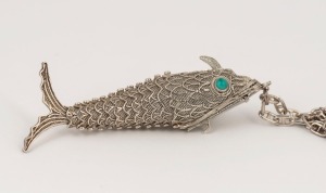 A filigree silver articulated fish pendant on chain,  the pendant 7.5cm long