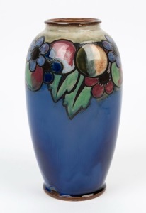 ROYAL DOULTON stone ware floral vase on blue ground, early 20th century, impressed factory mark to base, 23.5cm high