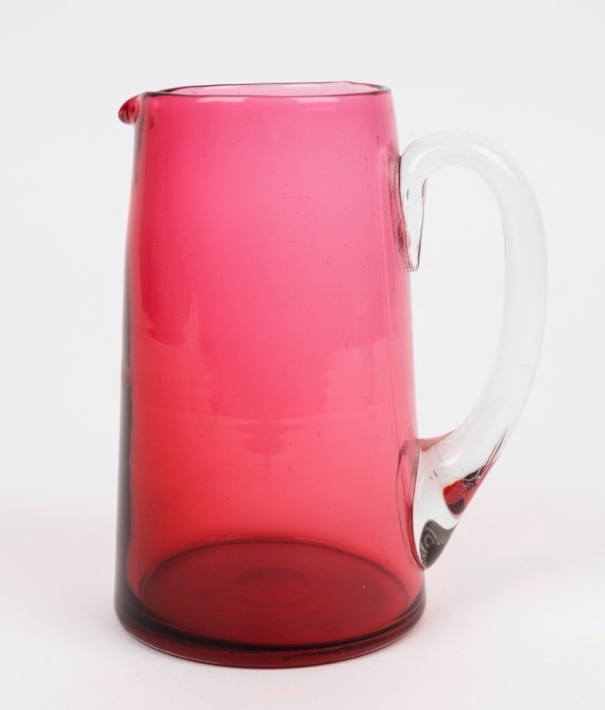 An antique ruby glass pitcher, 19th century, 18cm high