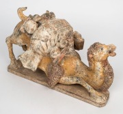 A Chinese pottery camel statue with remains of polychrome finish, modeled in unusual pose, Tang Dynasty (618 to 907 A.D.). With accompanying&nbsp;thermoluminescence test certificate from Oxford Authentication Ltd, United Kingdom (HK 2123-691). 18cm high, 35cm - 3