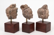 A group of three Gandharan terracotta heads of a Bodhisattva, circa 3rd century A.D., approximately 7cm high each (excluding stands) - 3