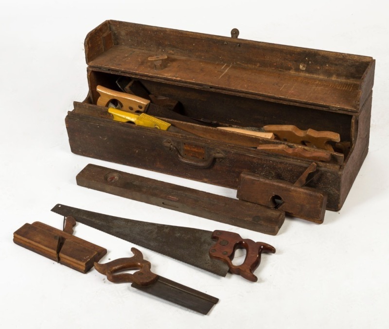 An antique timber toolbox with assorted carpenter's tools including handsaws, wood planes, levels etc., 19th/20th century, 83cm wide