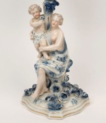 An antique German blue and white porcelain candelabra with figural base, 19th century,&nbsp; blue factory mark to base, ​​​​​​​47cm high - 2