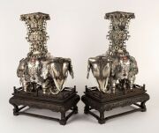 A pair of impressive Chinese silver elephant vases adorned with carved jade rings and semi-precious stones, 19th/20th century, an impressive 42cm high