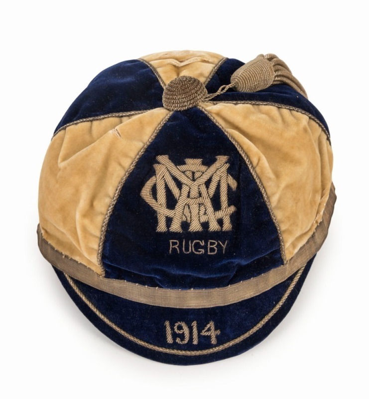 YMCA Rugby honour cap 1914, with sectioned top in blue and beige velvet, metallic thread monogram and date, matching tassel, maker's label to interior 'J.Pearson, 21 King St Arcade, Sydney'. Generally, in extremely fine condition.